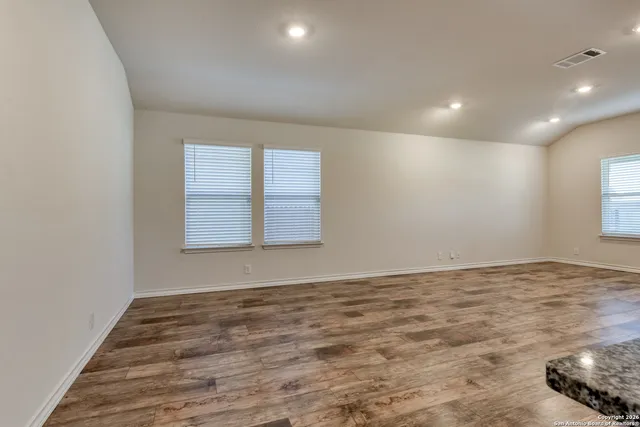 a view of an empty room and window