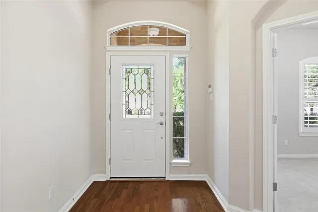 a view of storage and utility room with window