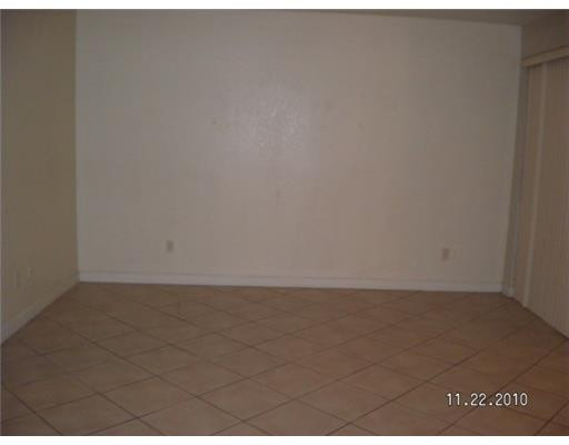 4445 Southwest 160th Avenue, Unit 101 Miramar, FL 33027 - Photo 4 of 8 a view of an empty room and window
