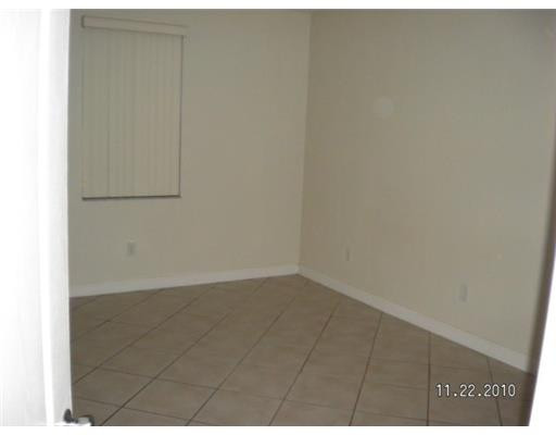 4445 Southwest 160th Avenue, Unit 101 Miramar, FL 33027 - Photo 5 of 8 a view of an empty room