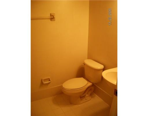 4445 Southwest 160th Avenue, Unit 101 Miramar, FL 33027 - Photo 8 of 8 a white toilet sitting next to a white wall