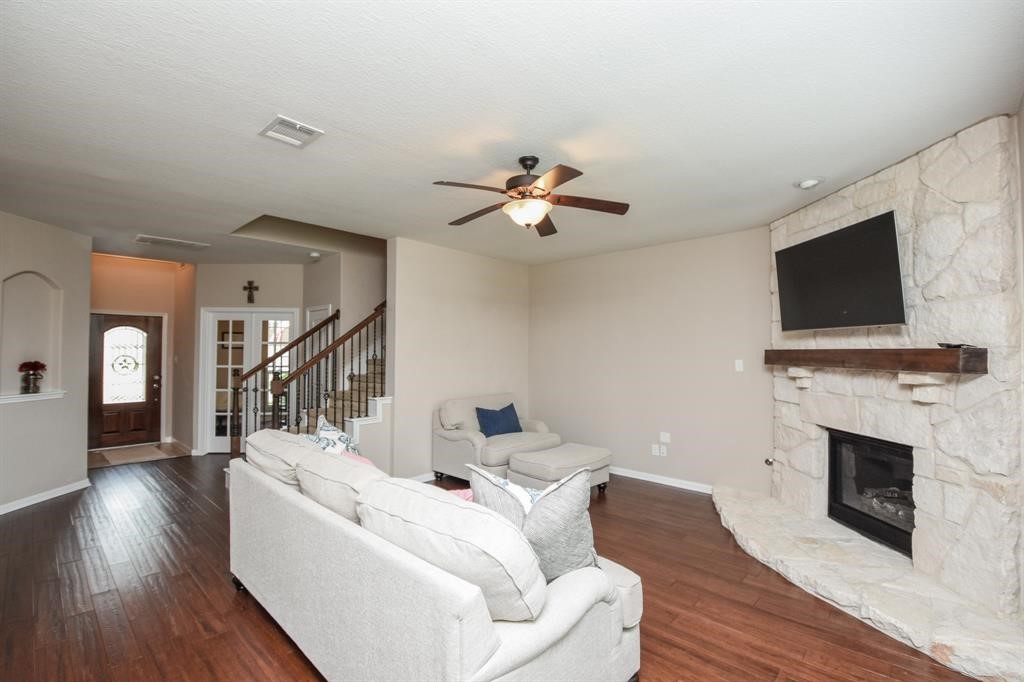 7002 Edwanna Lane Spring, TX 77389 - Photo 6 of 17 a living room with furniture and a fireplace