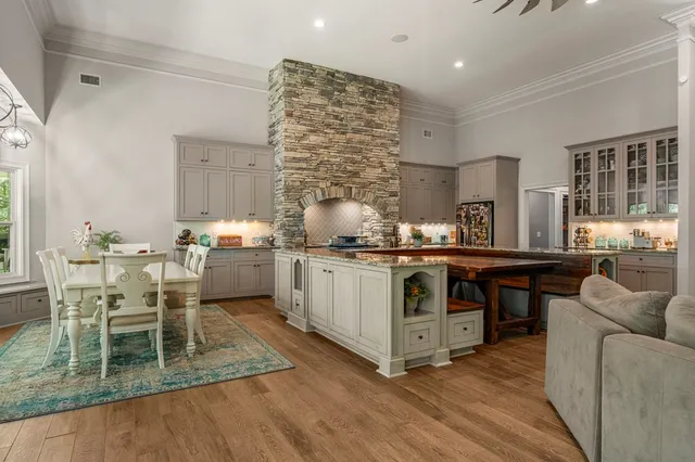 a kitchen with a cabinets and chairs
