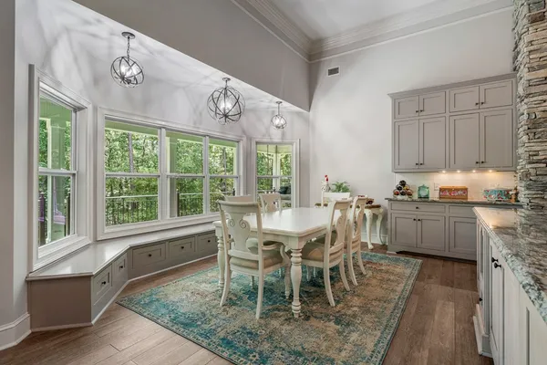 a view of a dining room with furniture window and outside view