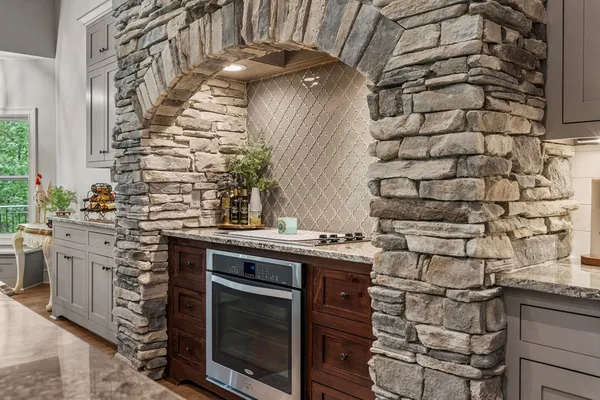a kitchen with a stove and a sink