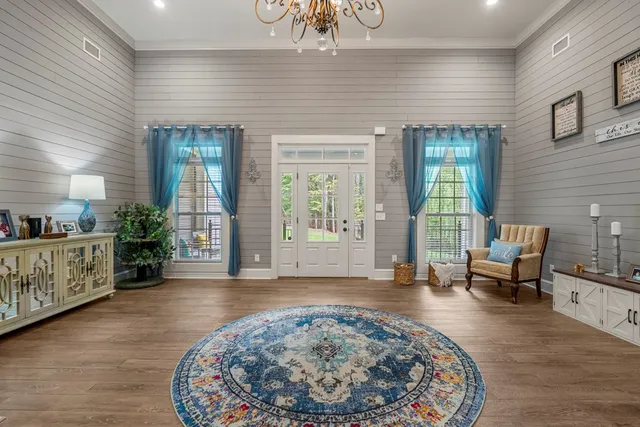 a view of a livingroom with furniture and windows