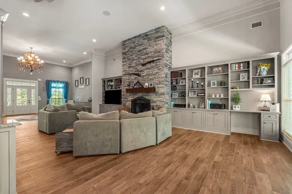 a living room with furniture and a fireplace