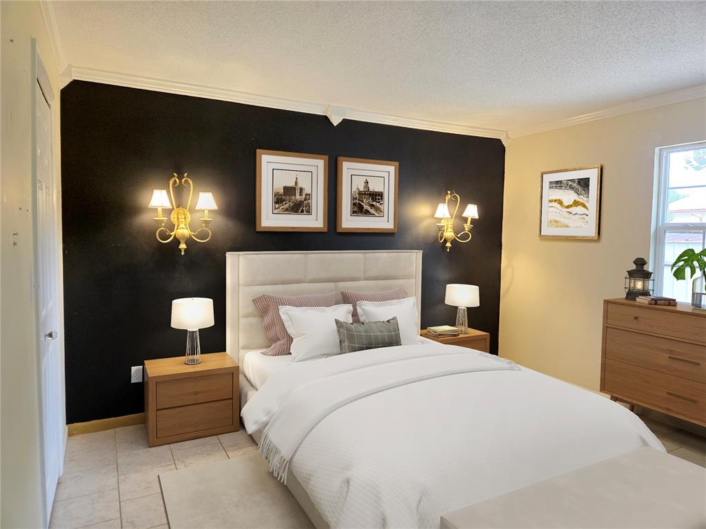 19 Spring Dr Place Ocala, FL 34472 - Photo 19 of 29 a bedroom with a bed and a chandelier