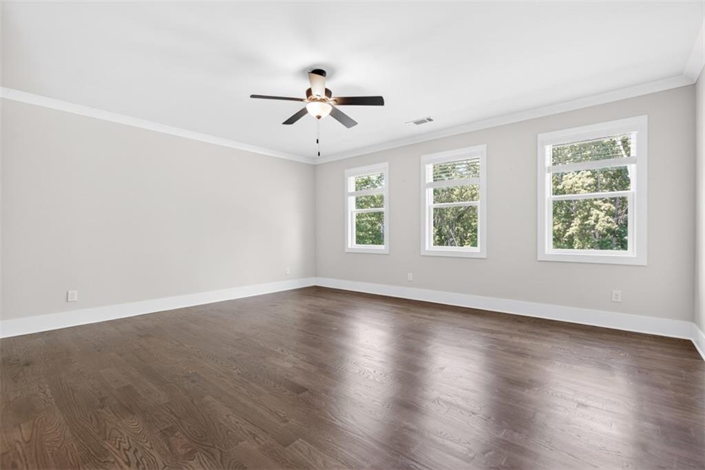 3528 North Bogan Road Buford, GA 30519 - Photo 43 of 79 a view of an empty room with wooden floor and window