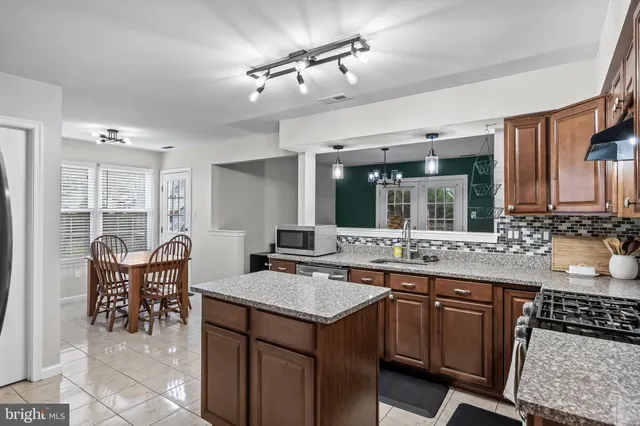 a kitchen with a stove and a refrigerator