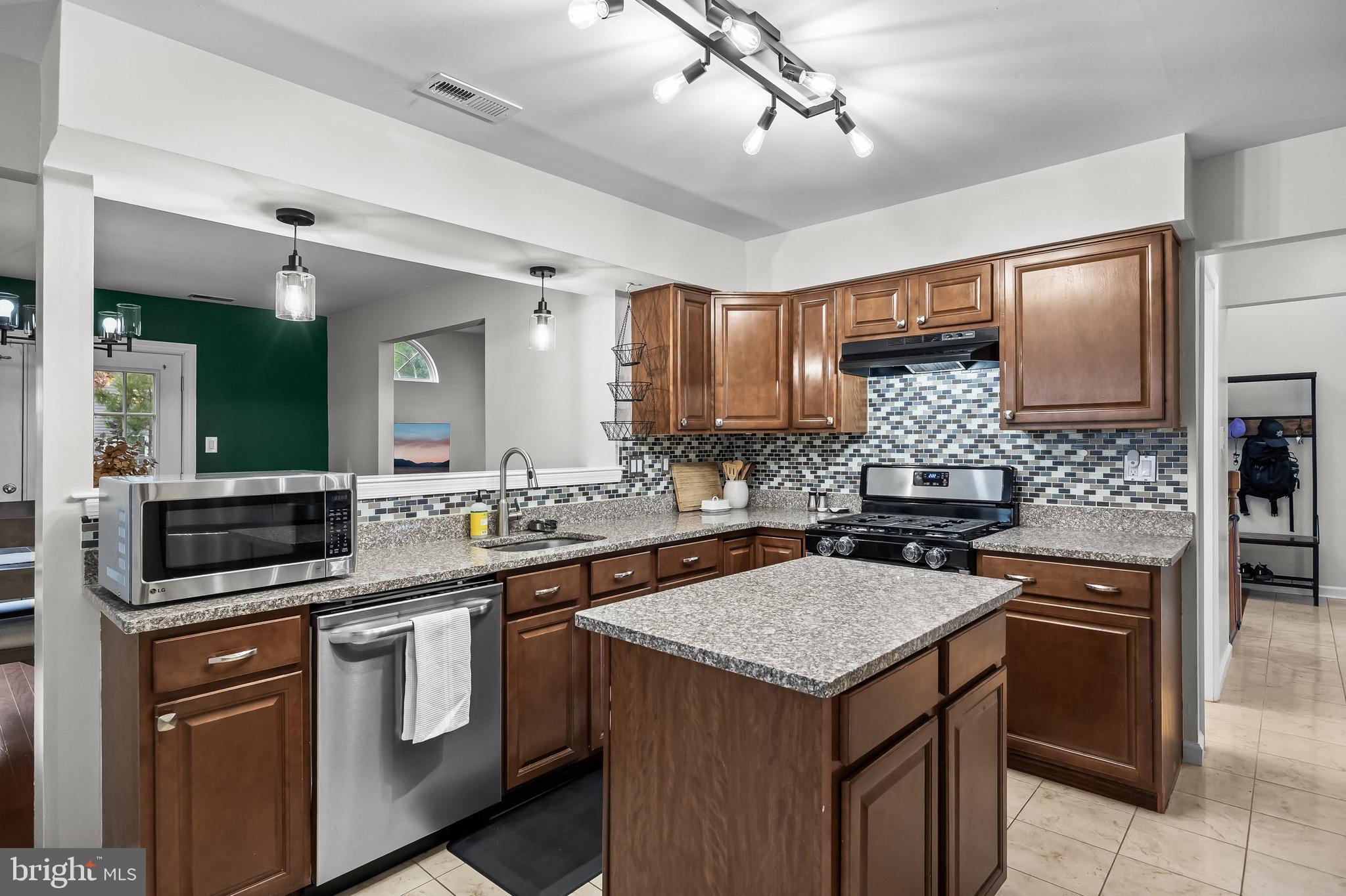 5 Hampton Court Mount Laurel, NJ 08054 - Photo 21 of 46 a kitchen with a stove and a refrigerator