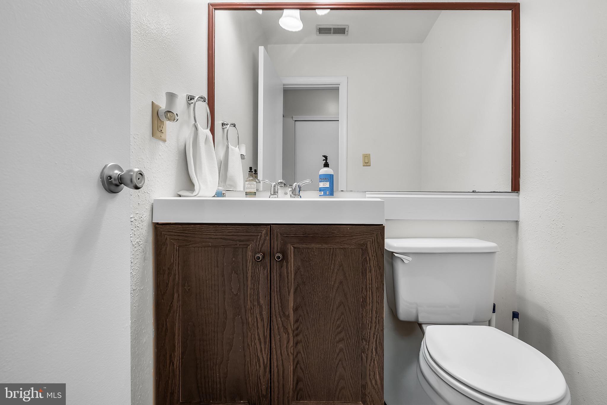 5 Hampton Court Mount Laurel, NJ 08054 - Photo 24 of 46 a bathroom with a sink vanity mirror and toilet