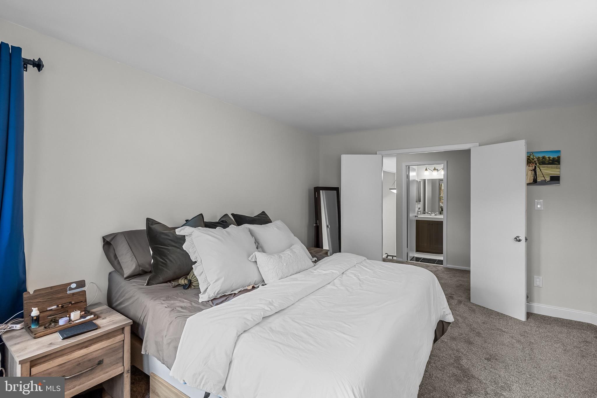 5 Hampton Court Mount Laurel, NJ 08054 - Photo 26 of 46 a bedroom with a bed and a lamp on dresser