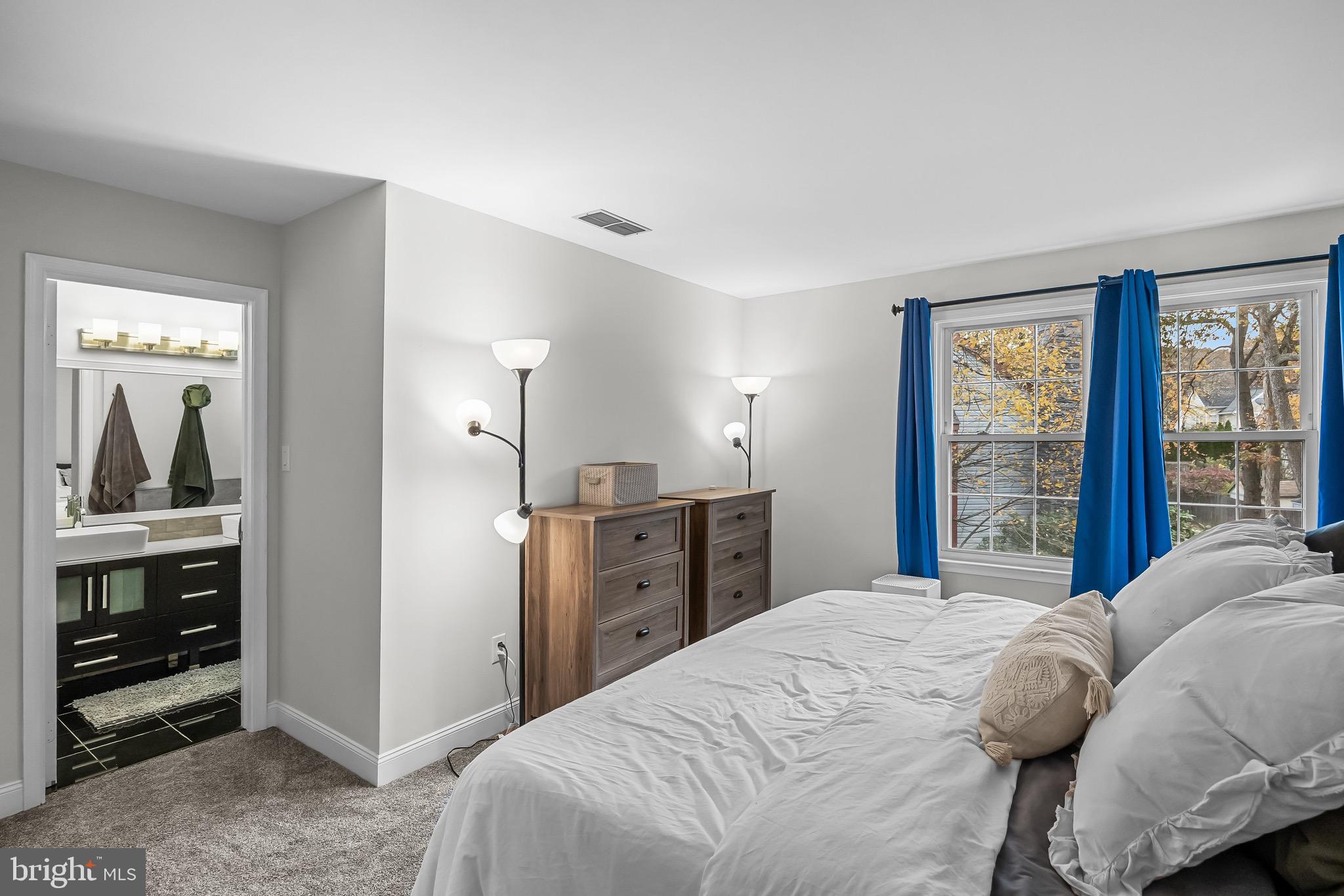 5 Hampton Court Mount Laurel, NJ 08054 - Photo 27 of 46 a bedroom with a large bed and a window