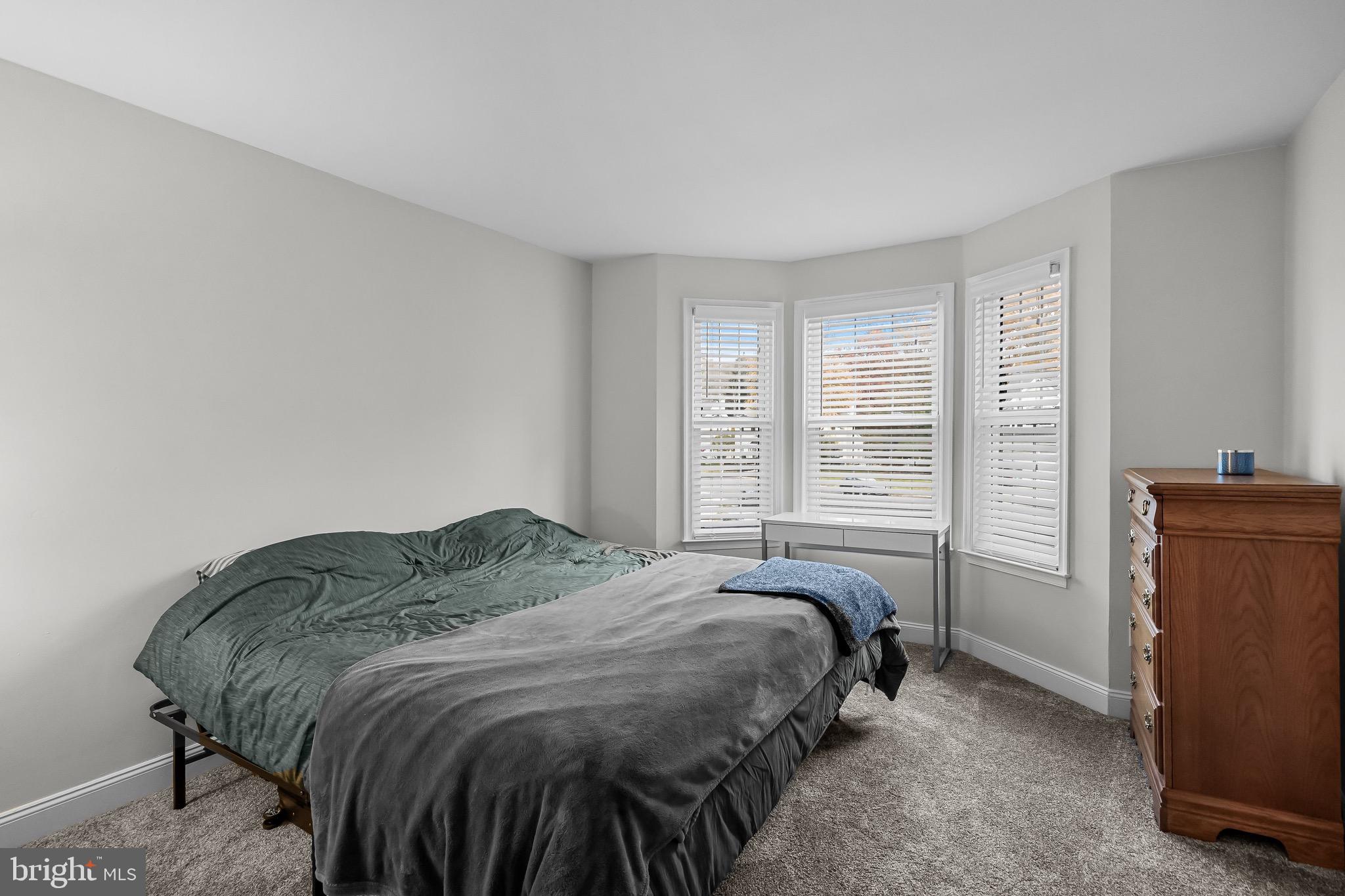 5 Hampton Court Mount Laurel, NJ 08054 - Photo 29 of 46 a spacious bedroom with a bed and a refrigerator