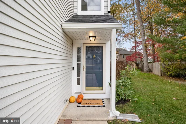 a front view of a house with a white door