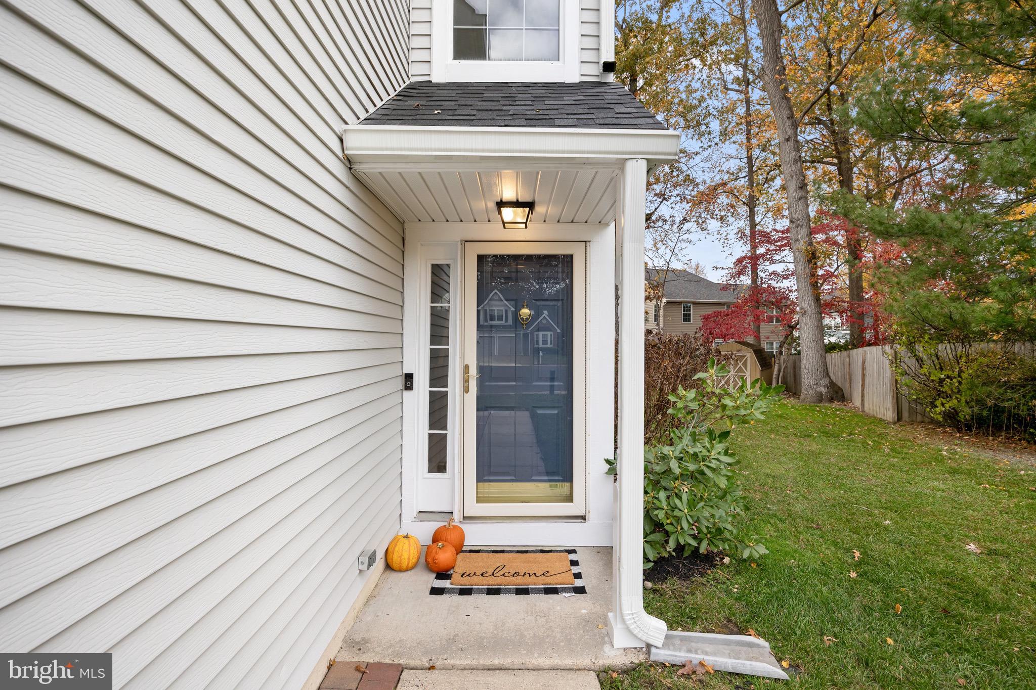 5 Hampton Court Mount Laurel, NJ 08054 - Photo 4 of 46 a front view of a house with a white door