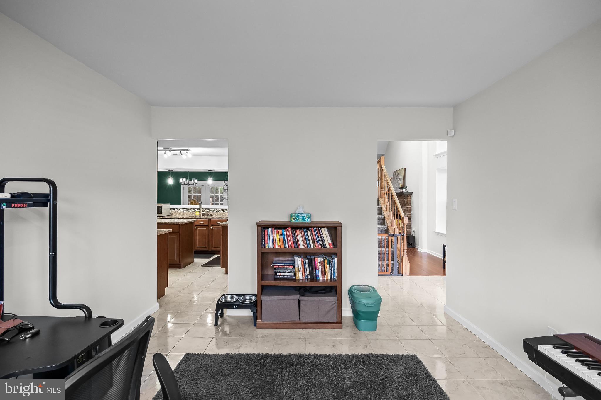 5 Hampton Court Mount Laurel, NJ 08054 - Photo 8 of 46 a living room with furniture and book shelf