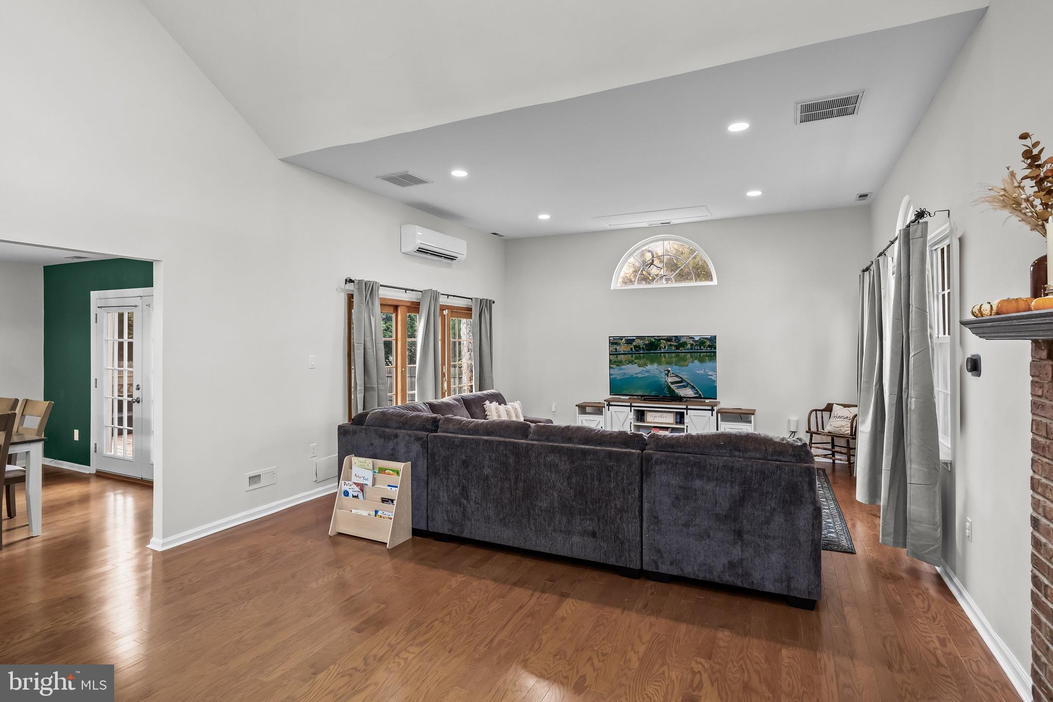 5 Hampton Court Mount Laurel, NJ 08054 - Photo 9 of 46 a living room with furniture wooden floor and a flat screen tv