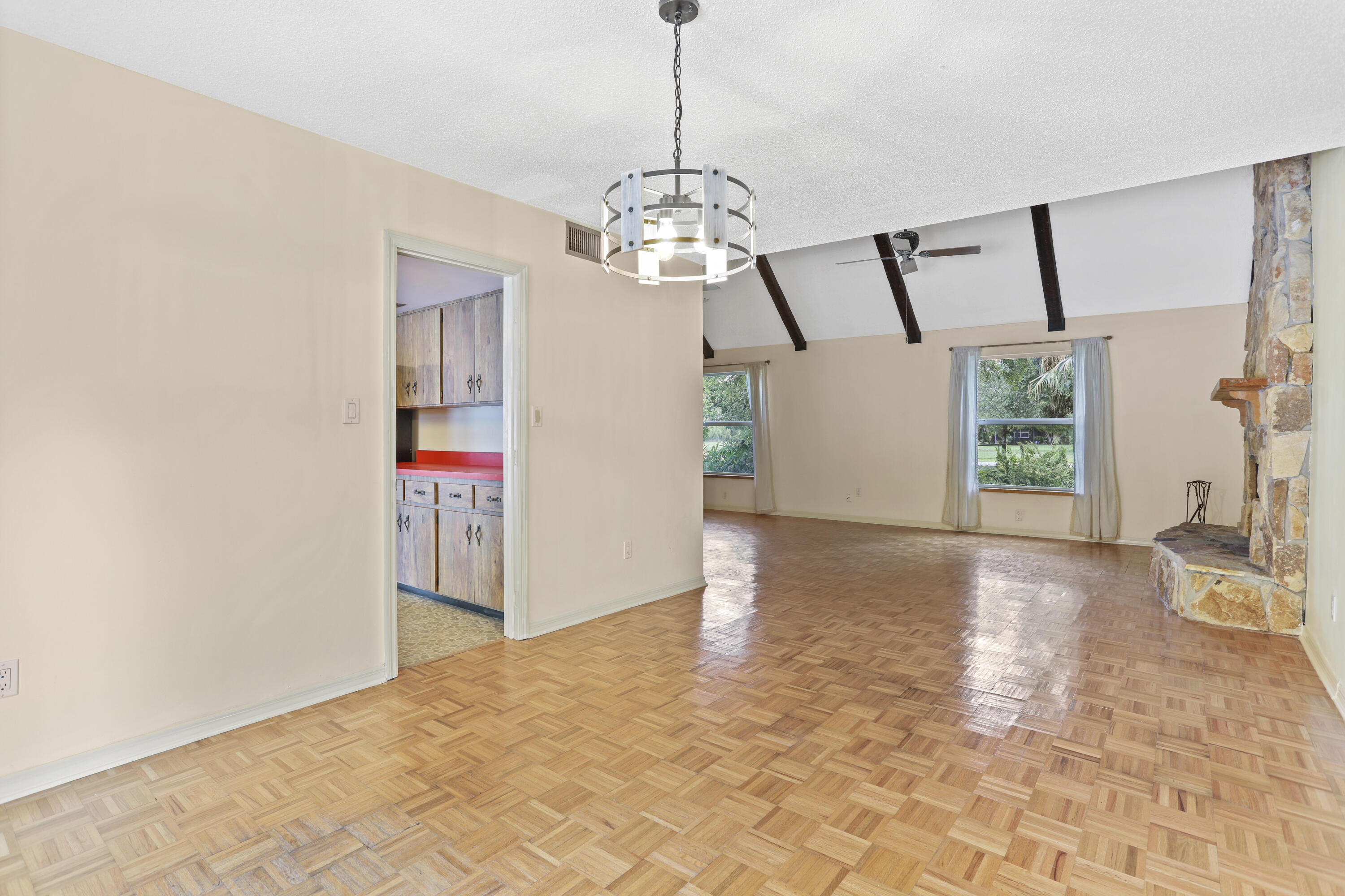 8791 Hidden Pines Road Fort Pierce, FL 34945 - Photo 13 of 55 a view of a chandelier in big room and chandelier