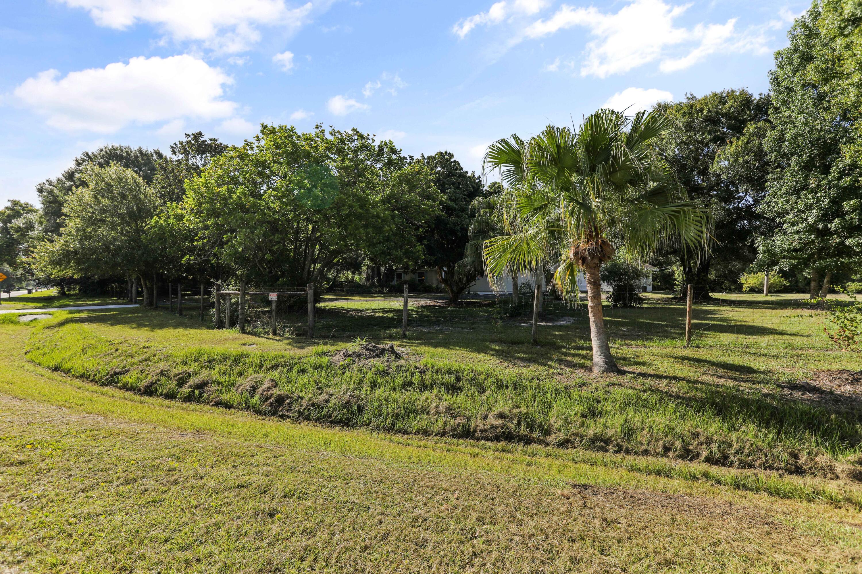 8791 Hidden Pines Road Fort Pierce, FL 34945 - Photo 51 of 55 a view of a yard with swimming pool