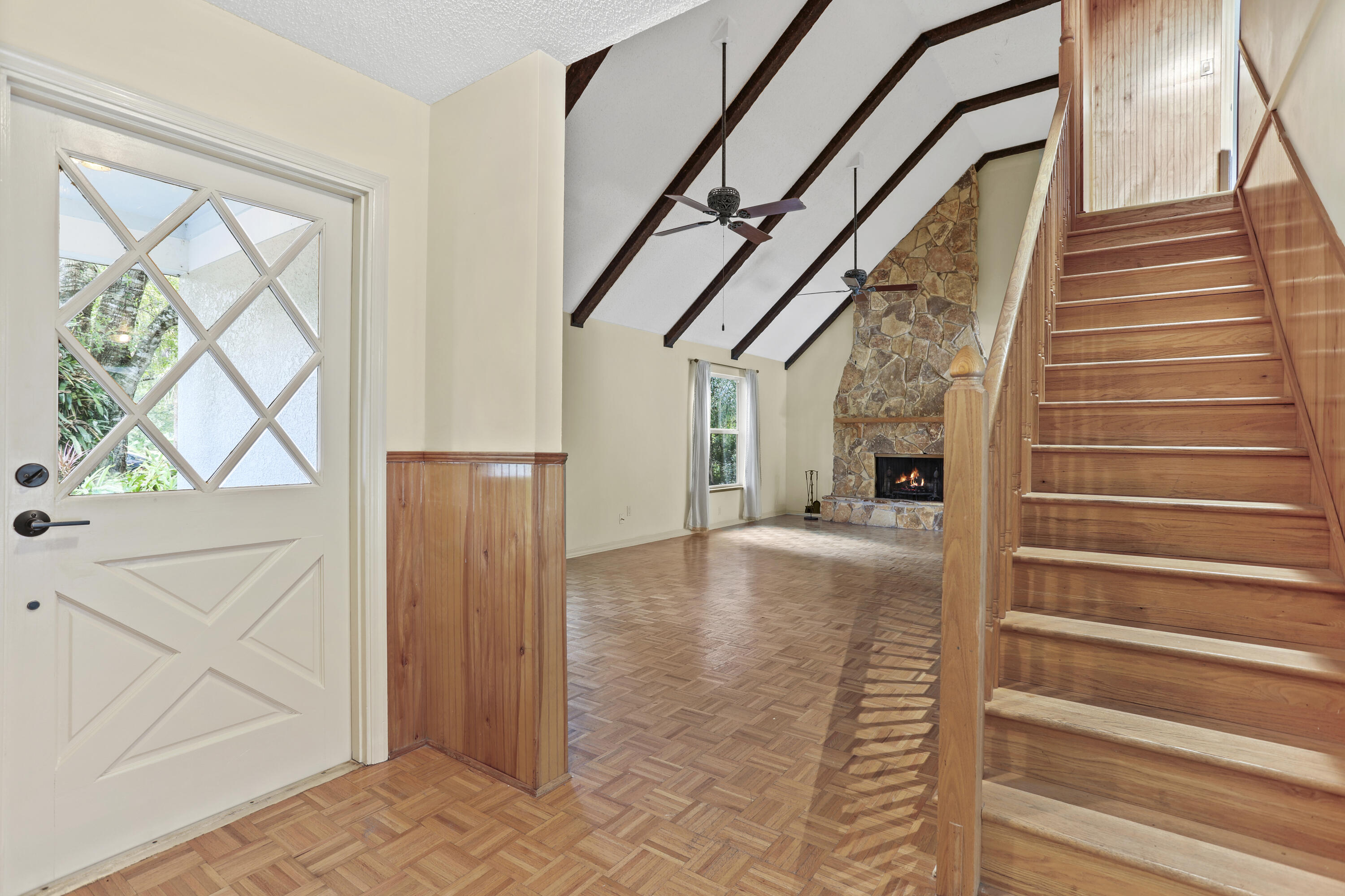 8791 Hidden Pines Road Fort Pierce, FL 34945 - Photo 7 of 55 a view of entryway and hall with wooden floor