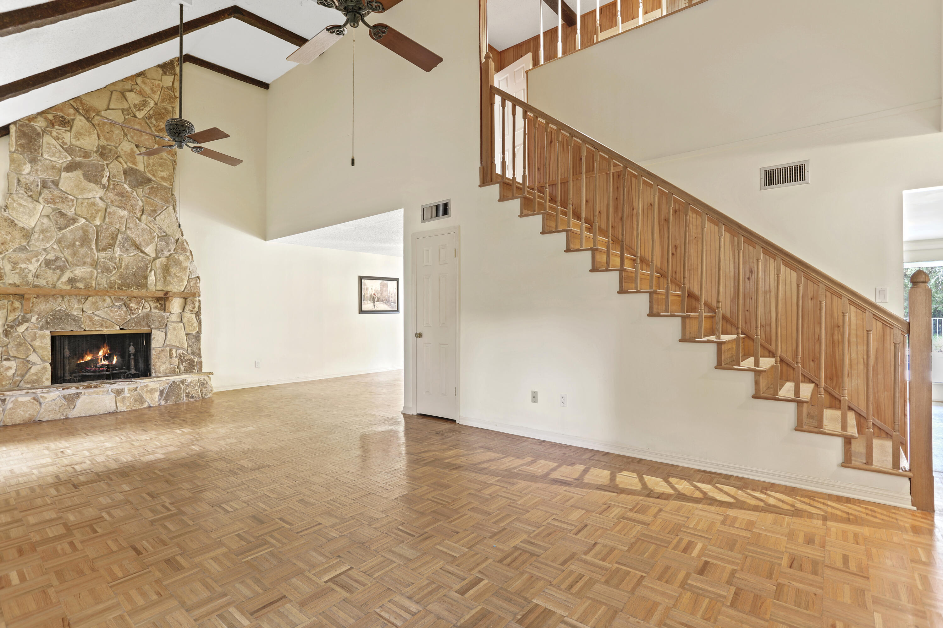 8791 Hidden Pines Road Fort Pierce, FL 34945 - Photo 8 of 55 a view of entryway and hall with wooden floor