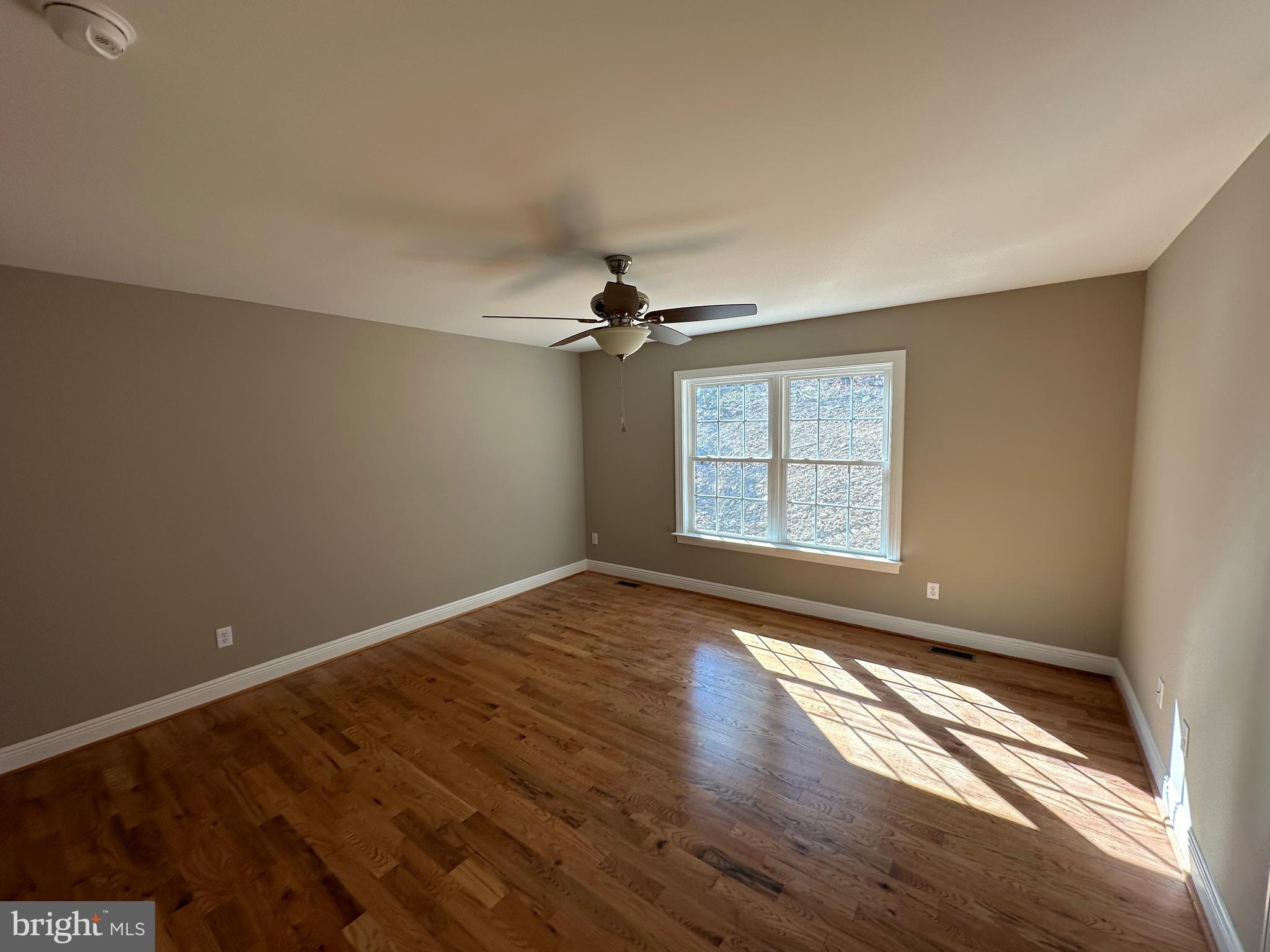 107 Pinto Trail Winchester, VA 22602 - Photo 15 of 32 wooden floor in an empty room with a window