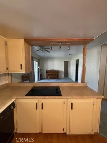 a view of a kitchen with furniture and a kitchen