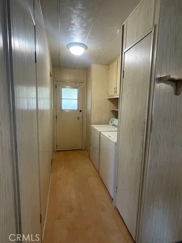 a view of a bedroom with natural light and windows
