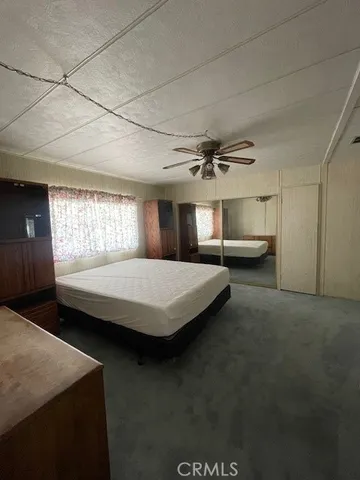 a bed room with a bed and window