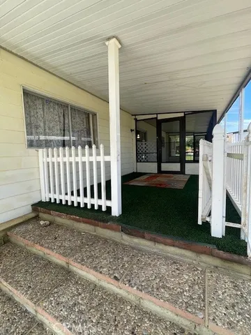 a view of a porch with a yard