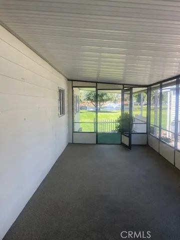 a view of an empty room with a balcony