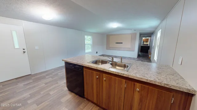 a kitchen with a sink and cabinets