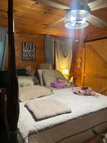 a view of backyard with seating area and green space