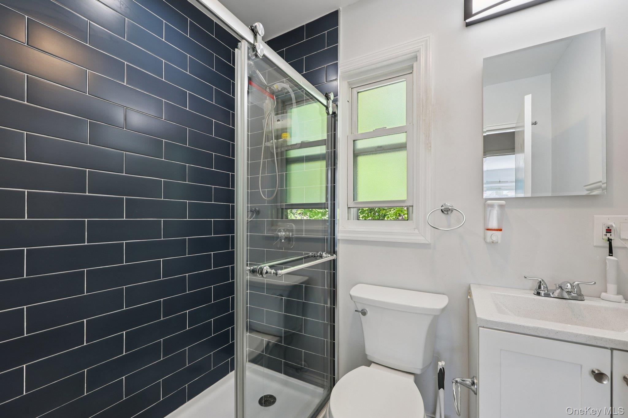 24 Wappanocca Avenue, Unit B Rye, NY 10580 - Photo 11 of 14 a bathroom with a sink a toilet and a shower