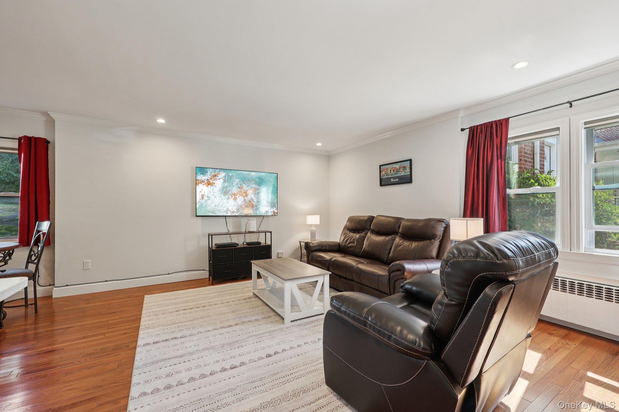 24 Wappanocca Avenue, Unit B Rye, NY 10580 - Photo 3 of 14 a living room with furniture a wooden floor and a flat screen tv