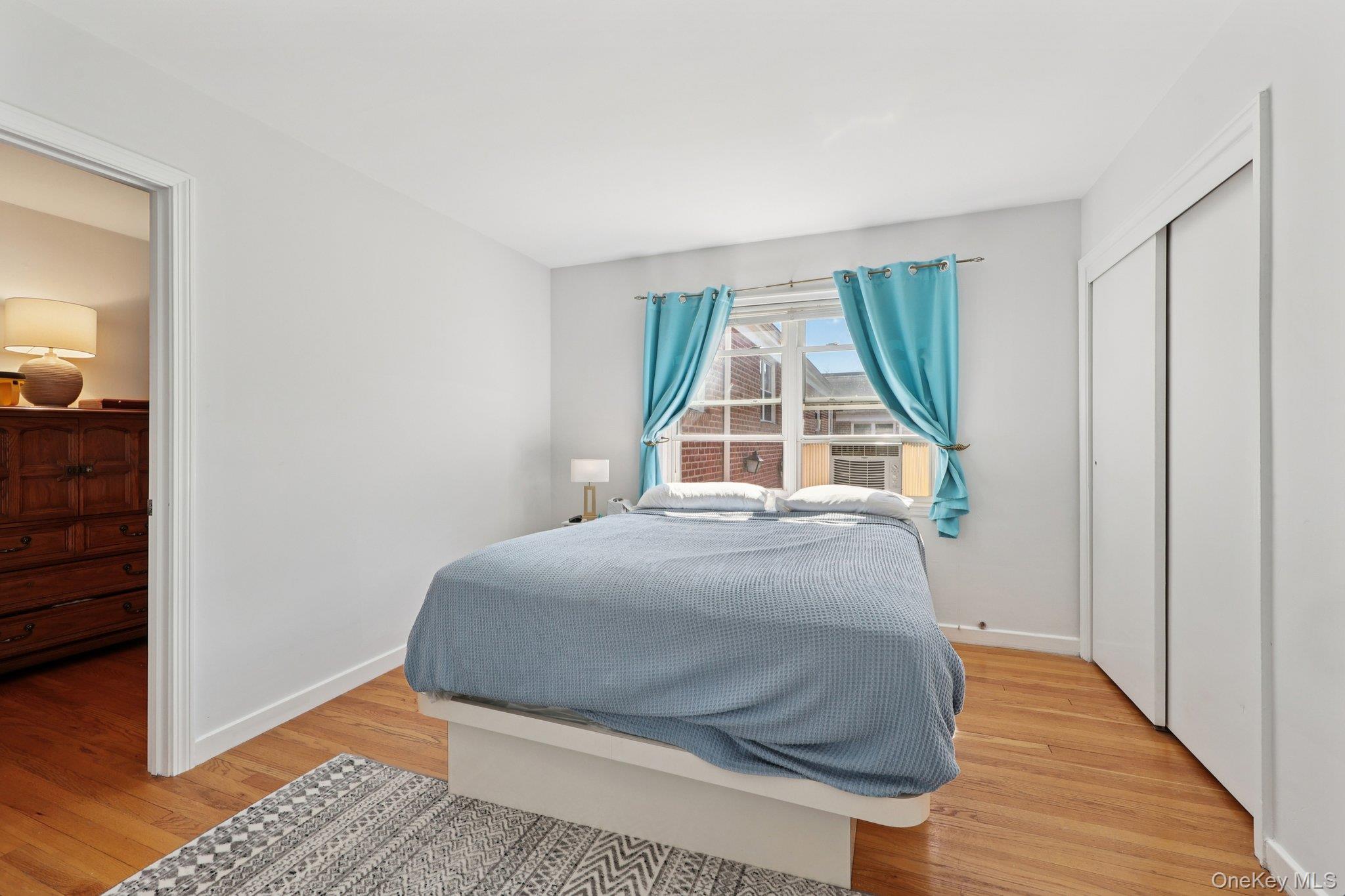 24 Wappanocca Avenue, Unit B Rye, NY 10580 - Photo 9 of 14 a bedroom with a bed and wooden floor