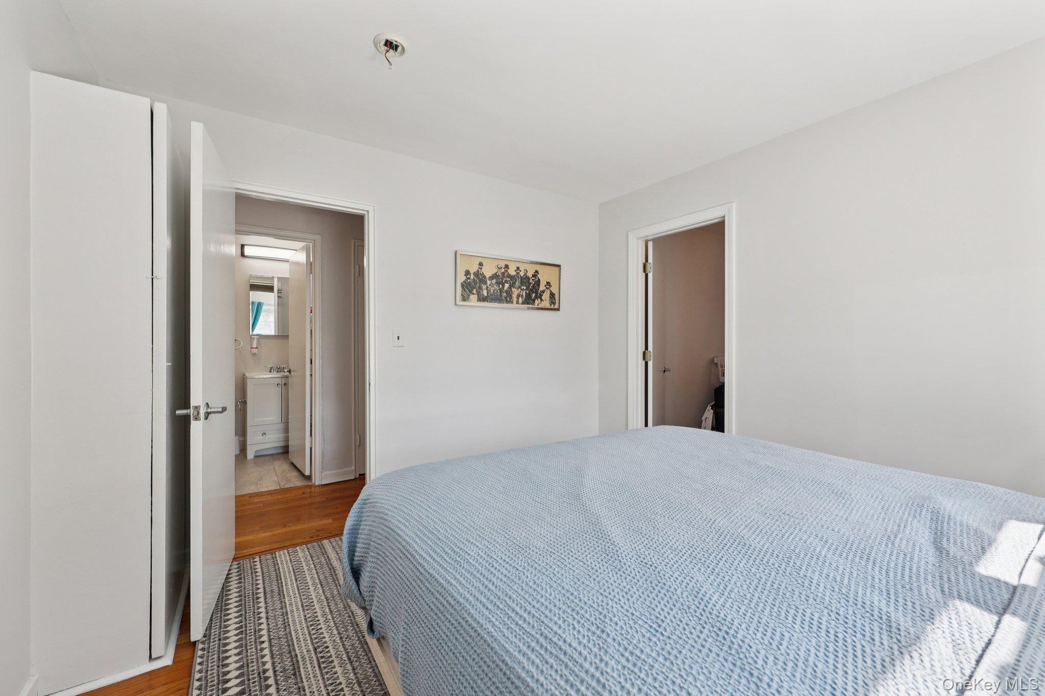 24 Wappanocca Avenue, Unit B Rye, NY 10580 - Photo 10 of 14 a bedroom with a bed and wooden floor