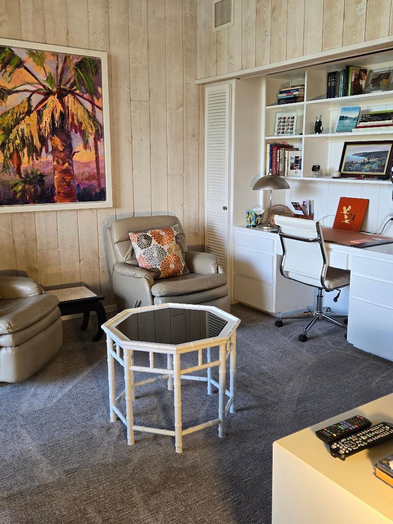910 Island Drive, Unit 113 Rancho Mirage, CA 92270 - Photo 19 of 40 a room with furniture a rug and a window