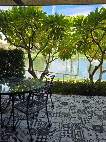 a view of a backyard with sitting area