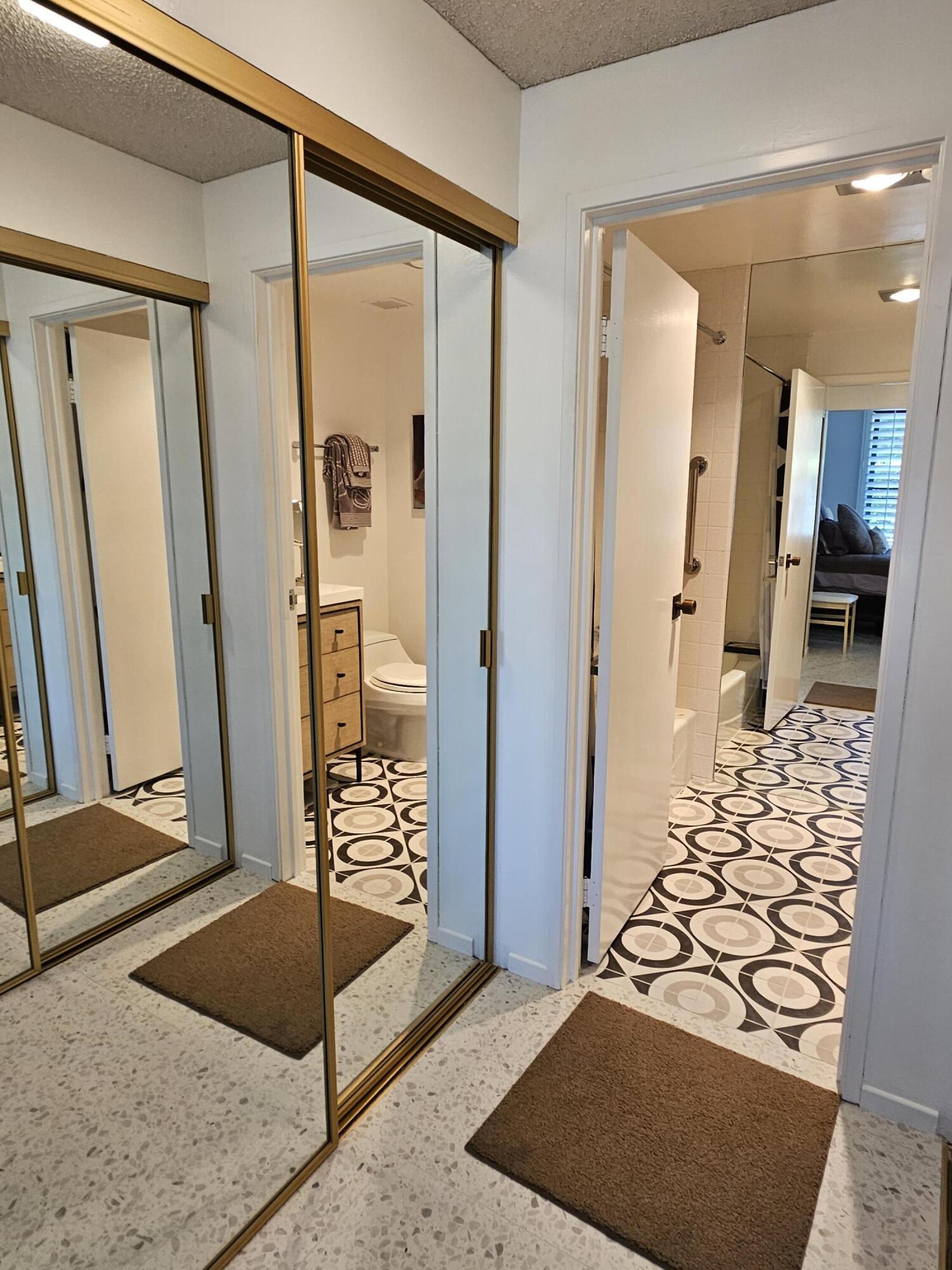 910 Island Drive, Unit 113 Rancho Mirage, CA 92270 - Photo 36 of 40 a bathroom with a tub and shower