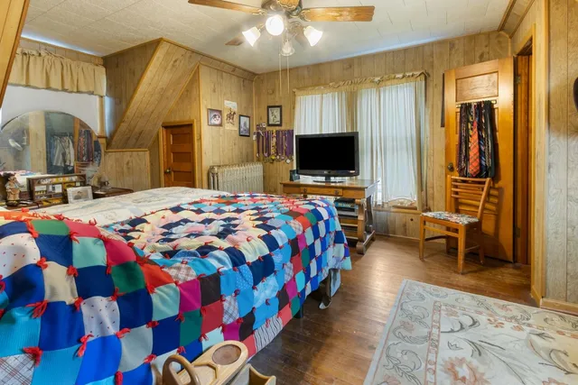 a bedroom with a bed and a dresser