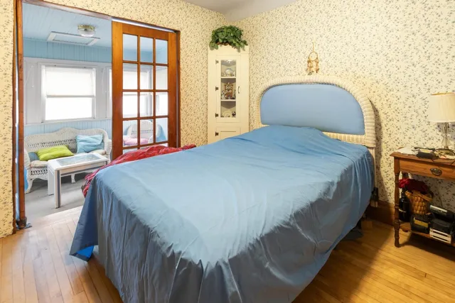 a bedroom with a bed and a couch