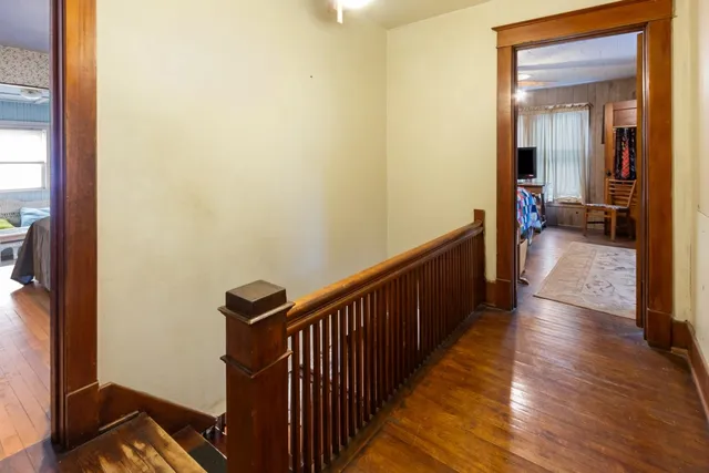 a bedroom with a bed and flat screen tv