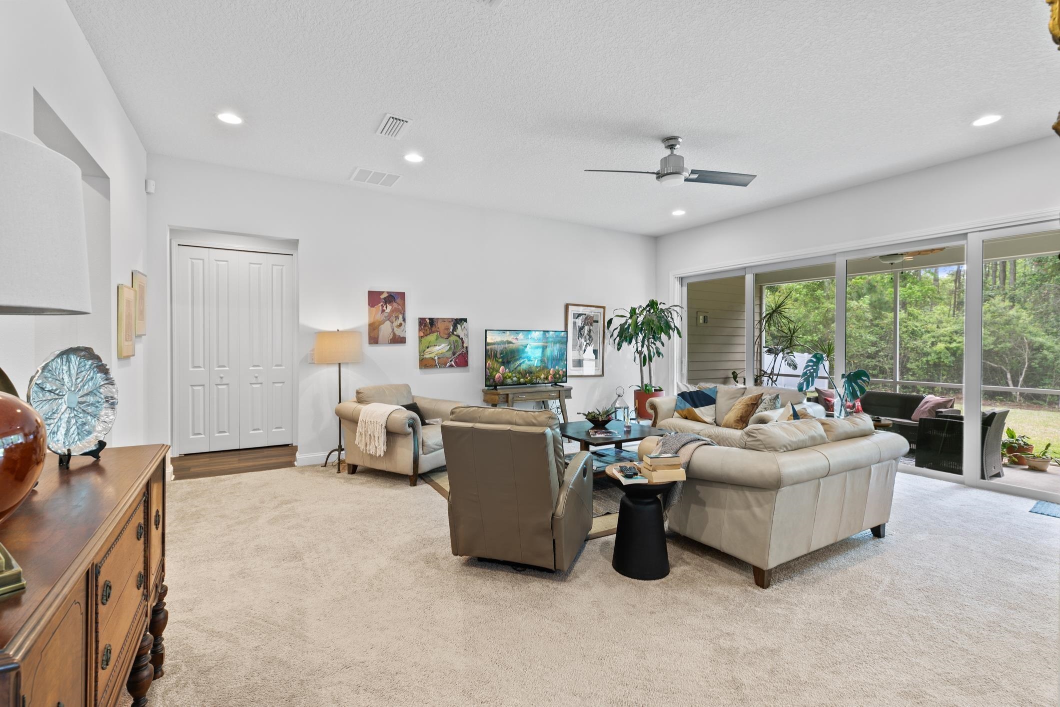 345 Downs Corner Road St. Augustine, FL 32092 - Photo 6 of 38 a living room with furniture and a large window