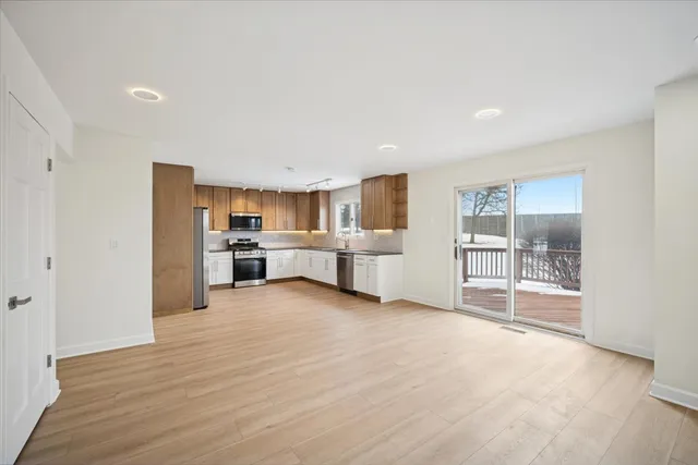 a view of kitchen with wooden floor