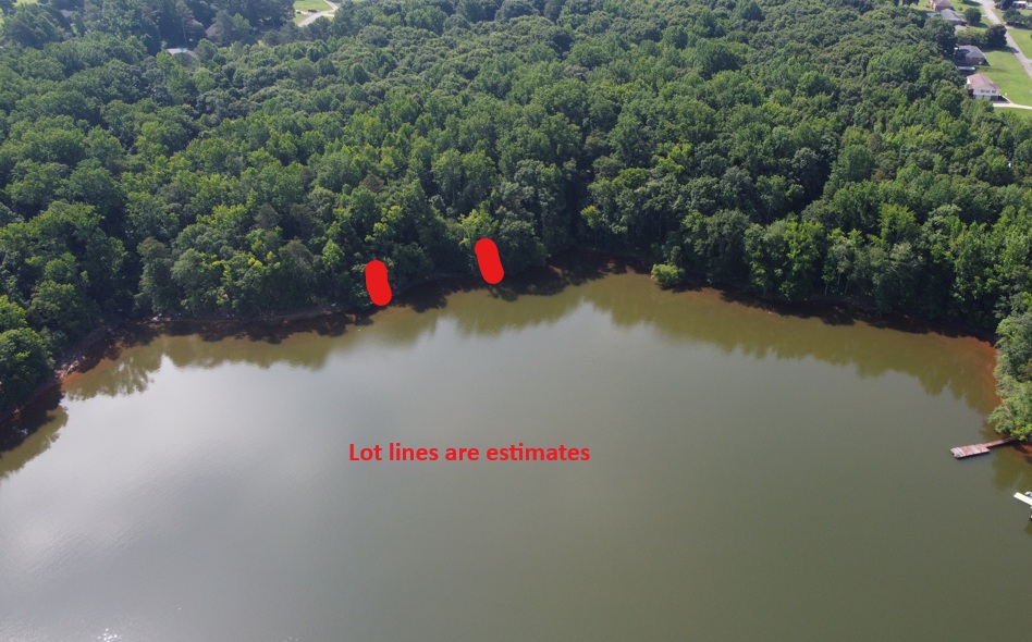 Lot 5 Little Creek Road Anderson, SC 29621 - Photo 2 of 3 This aerial view showcases a serene lakefront property with abundant trees and a private dock.