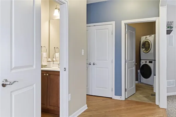 a view of a hallway with a washer and dryer