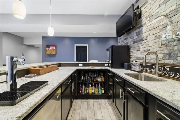 a kitchen with a stove sink and cabinets